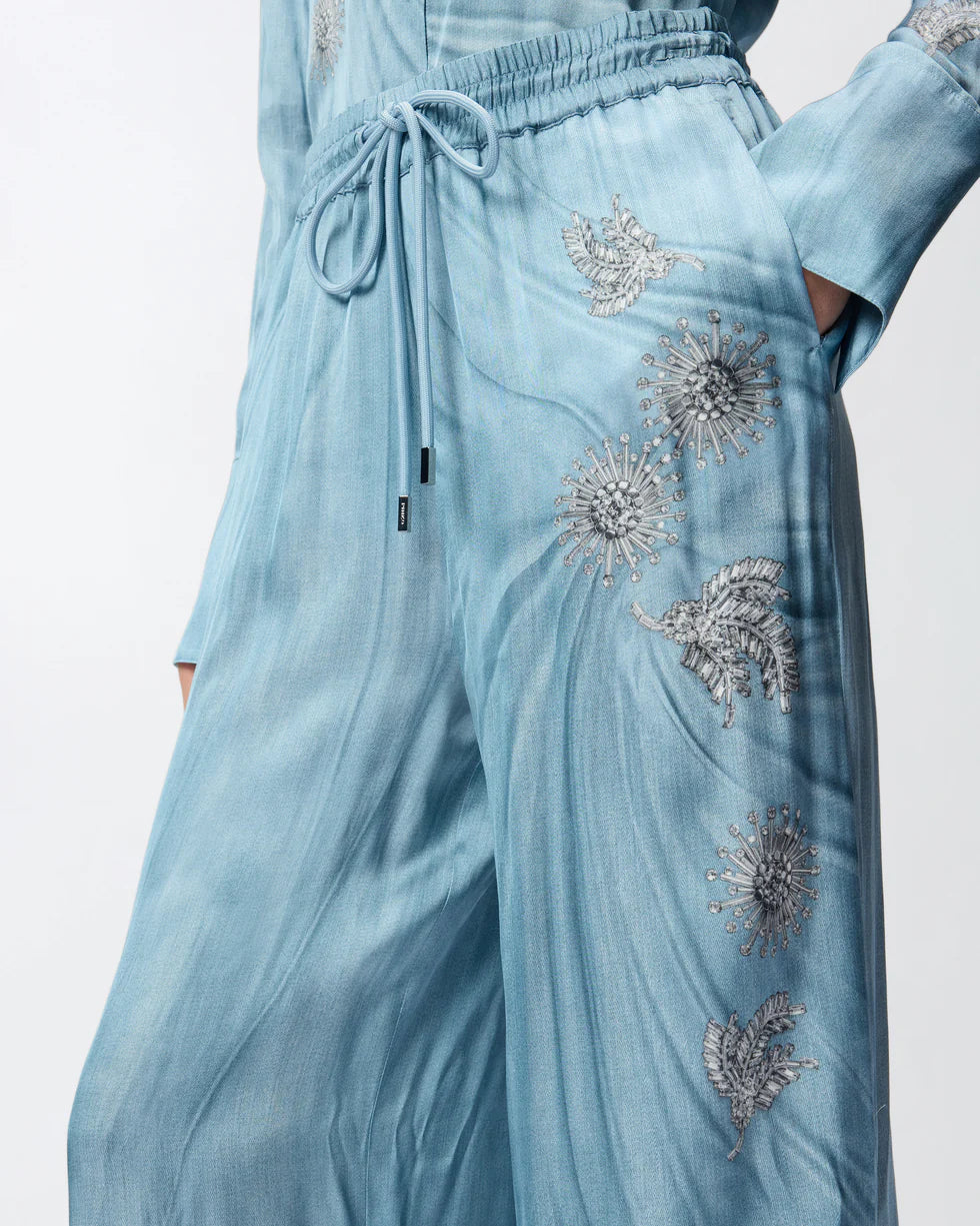 Pantaloni fluidi con stampa gioiello piazzata