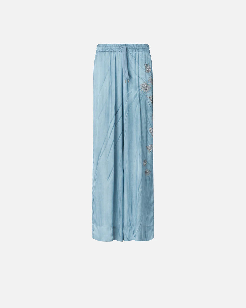 Pantaloni fluidi con stampa gioiello piazzata