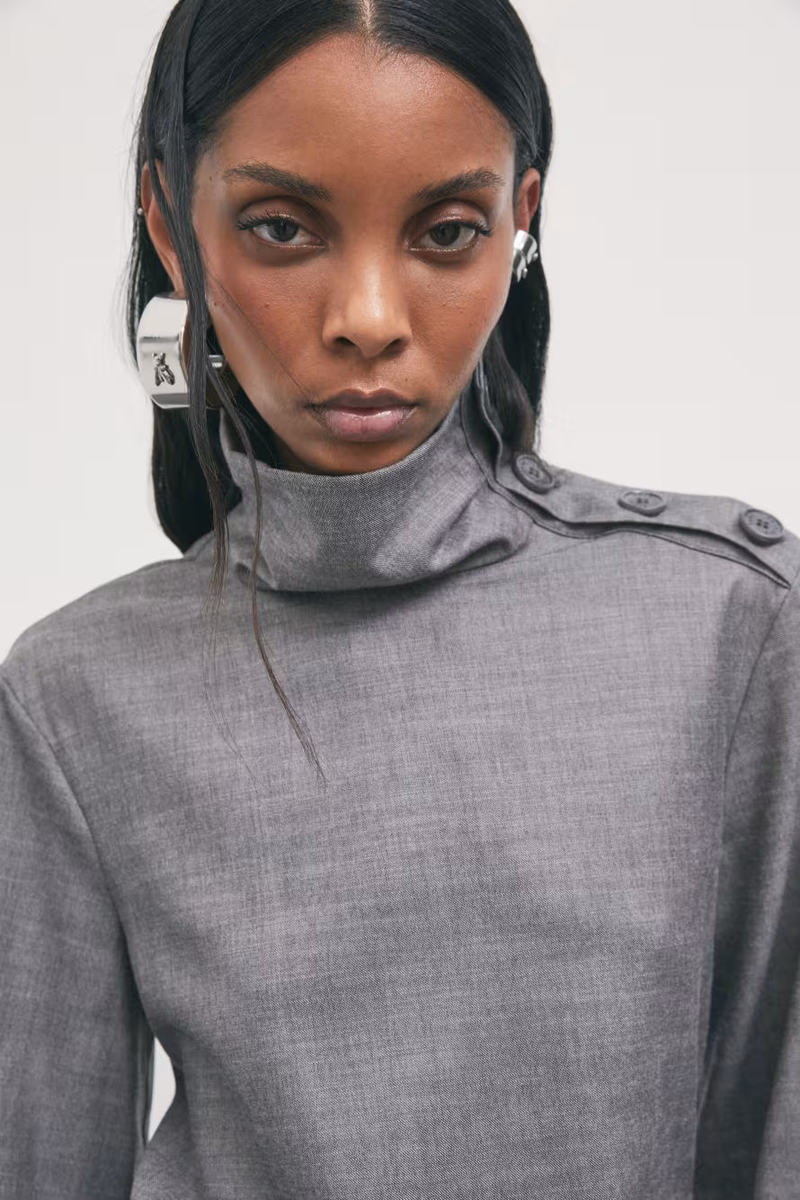 Blusa in flanella a collo alto con bottoni