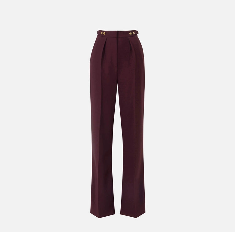 Pantaloni in crêpe con accessorio gioiello