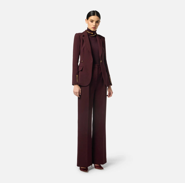 Pantaloni in crêpe con accessorio gioiello