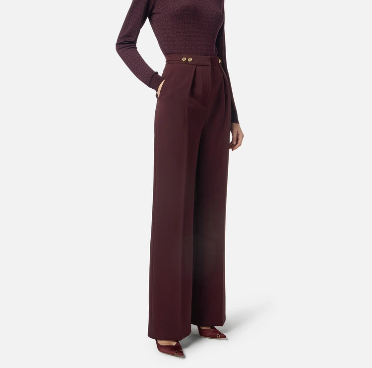 Pantaloni in crêpe con accessorio gioiello