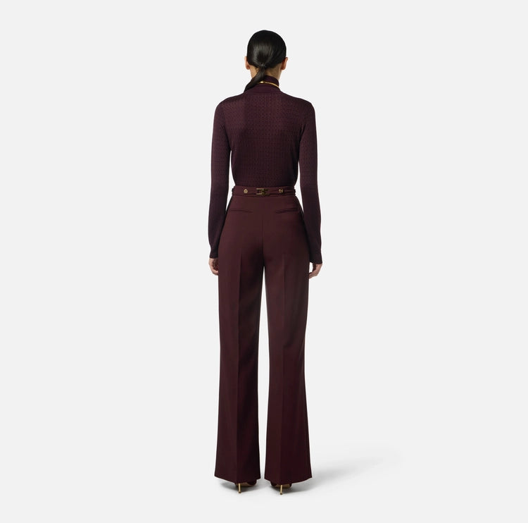 Pantaloni in crêpe con accessorio gioiello