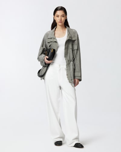 Pantaloni larghi loose fit con catena gioiello
